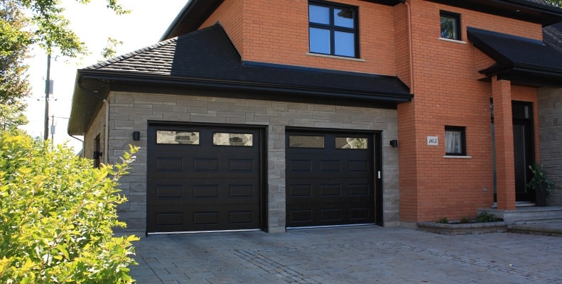Residential home with black garage doors