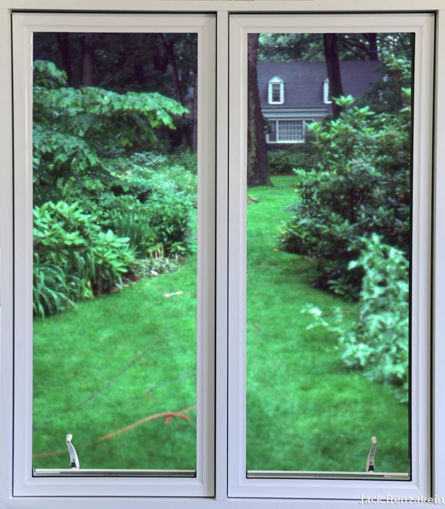 Double casement window garden and house view